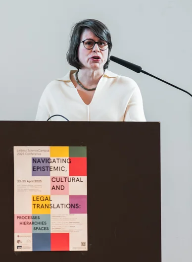 portrait of Prof. Liliana Gomez at the lectern during the LSC Conference
