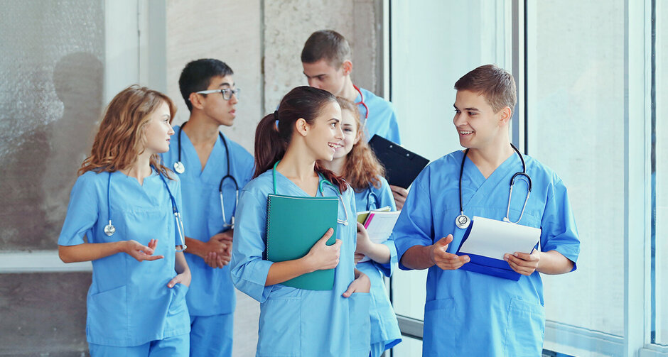 Young,Students,In,Hall,Of,University,Indoors