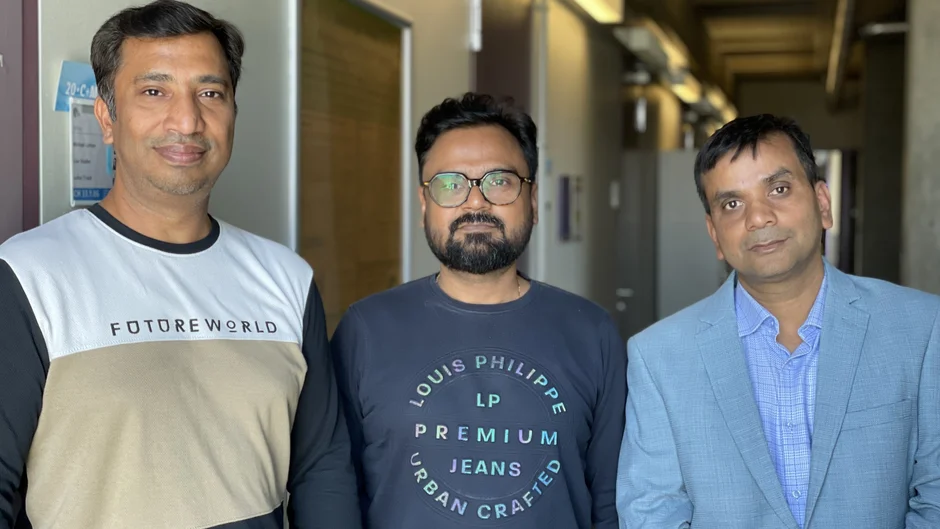 Group portrait of three men.
