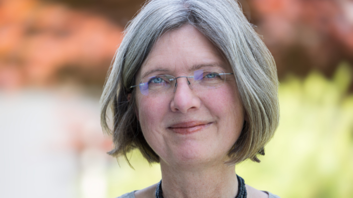 A woman is facing the camera.